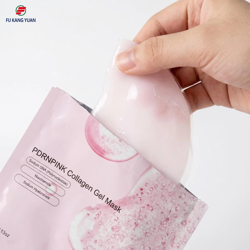 FKY Salmon DNA PDRN hydrogel mask being pulled from pouch, pink gel texture